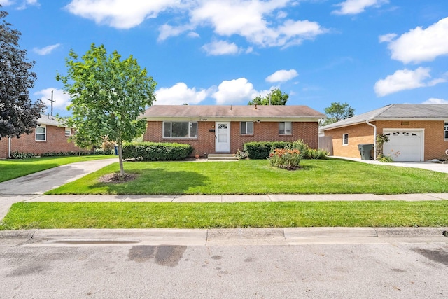 1799 Ormond Ave, Columbus, OH 43224 - ranch-style home featuring brick siding, a front lawn, an attached garage, and driveway