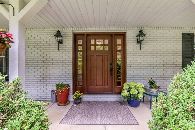 2211 Welsh Hills Rd NE, Granville, OH 43023 - doorway to property featuring covered porch and brick siding