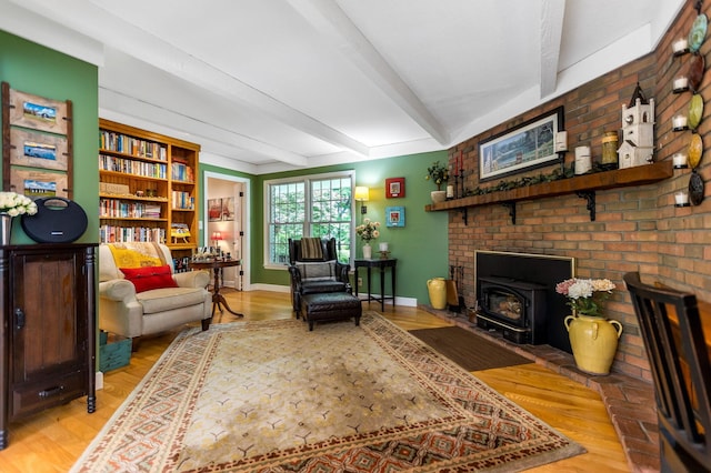 2211 Welsh Hills Rd NE, Granville, OH 43023 - living room featuring a wood stove, beamed ceiling, and light wood-style flooring