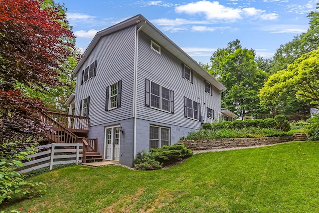 2211 Welsh Hills Rd NE, Granville, OH 43023 - back of property featuring a yard, stairway, and a wooden deck