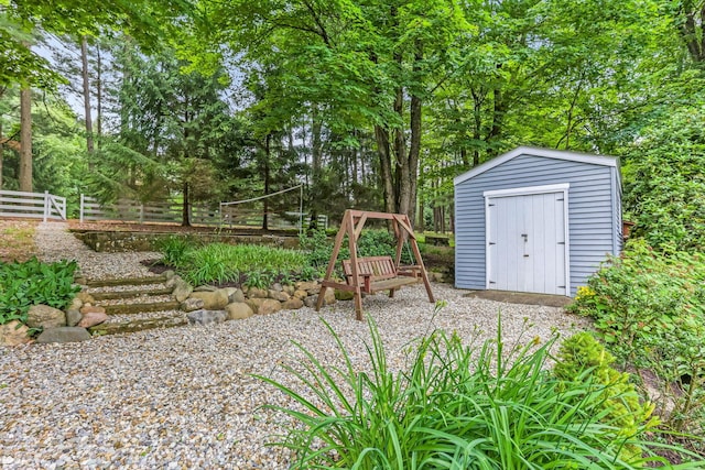 2211 Welsh Hills Rd NE, Granville, OH 43023 - view of yard with a storage shed and view of wooded area