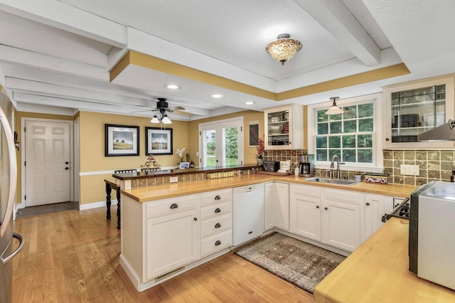 2211 Welsh Hills Rd NE, Granville, OH 43023 - kitchen with dishwasher, wooden counters, a peninsula, tasteful backsplash, and recessed lighting