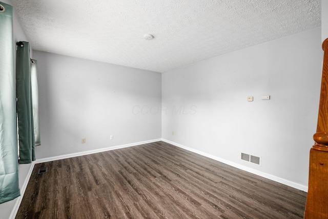 1191 Wexford Green Blvd, Columbus, OH 43228 - spare room featuring dark wood finished floors, a textured ceiling, and a smoke detector