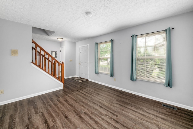 1191 Wexford Green Blvd, Columbus, OH 43228 - foyer entrance with wood finished floors, stairs, and a textured ceiling