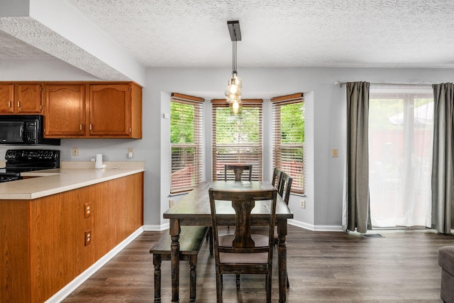 1191 Wexford Green Blvd, Columbus, OH 43228 - dining space with dark wood-type flooring and a textured ceiling