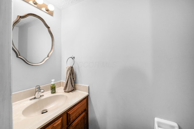 1191 Wexford Green Blvd, Columbus, OH 43228 - bathroom with vanity and a textured ceiling