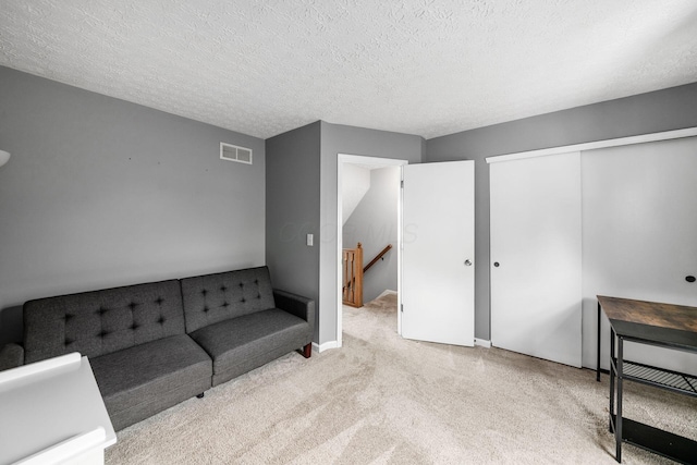 1191 Wexford Green Blvd, Columbus, OH 43228 - unfurnished living room with carpet flooring and a textured ceiling