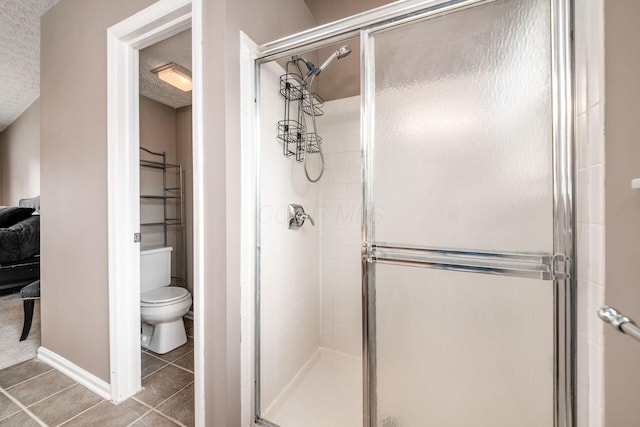1191 Wexford Green Blvd, Columbus, OH 43228 - bathroom with tile patterned floors, a stall shower, and a textured ceiling