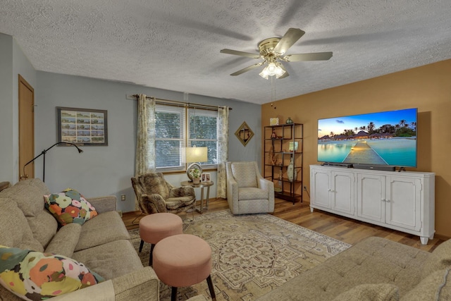 1588 Constitution Dr, Newark, OH 43055 - living area featuring wood finished floors, a ceiling fan, and a textured ceiling