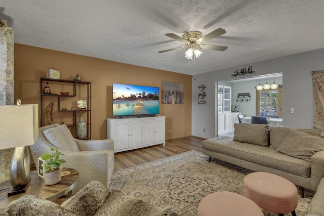 1588 Constitution Dr, Newark, OH 43055 - living room featuring a ceiling fan, wood finished floors, and a textured ceiling
