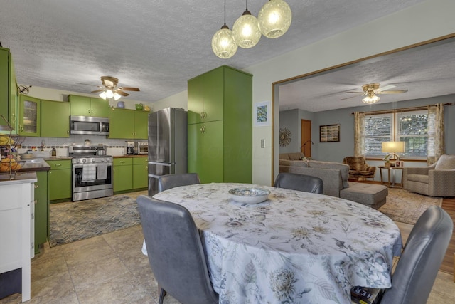 1588 Constitution Dr, Newark, OH 43055 - dining room featuring ceiling fan and a textured ceiling