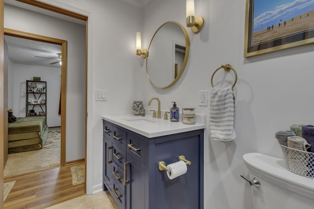 1588 Constitution Dr, Newark, OH 43055 - bathroom featuring ceiling fan, wood finished floors, crown molding, and vanity