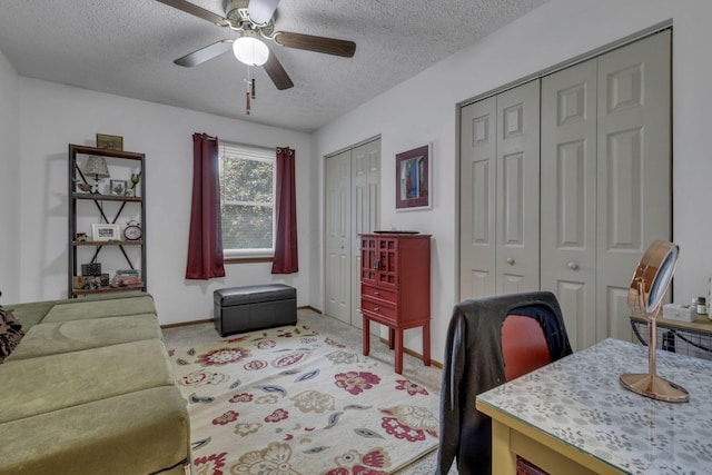 1588 Constitution Dr, Newark, OH 43055 - office space featuring a textured ceiling, ceiling fan, and light colored carpet