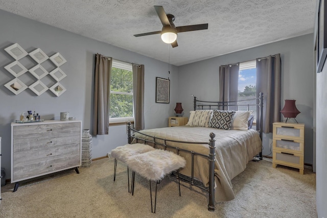 1588 Constitution Dr, Newark, OH 43055 - bedroom with light carpet, a textured ceiling, and ceiling fan