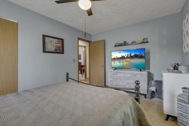 1588 Constitution Dr, Newark, OH 43055 - carpeted bedroom with a textured ceiling and ceiling fan