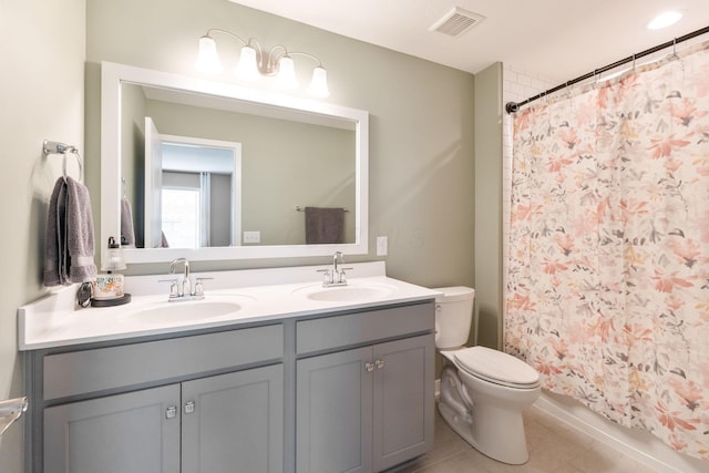 6452 Rockhold Dr, Westerville, OH 43081 - full bath with double vanity, a shower with shower curtain, and tile patterned flooring
