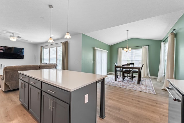 6452 Rockhold Dr, Westerville, OH 43081 - kitchen with light wood-style floors, dishwasher, light countertops, a chandelier, and plenty of natural light