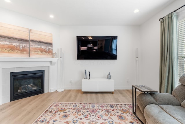 6452 Rockhold Dr, Westerville, OH 43081 - living room featuring wood finished floors, recessed lighting, and a fireplace
