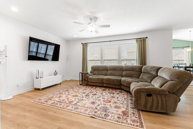 6452 Rockhold Dr, Westerville, OH 43081 - living room featuring ceiling fan, light wood-style flooring, a chandelier, and recessed lighting