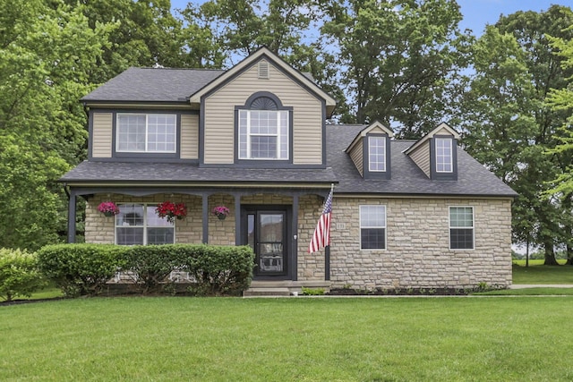 173 Zackary Dr, Granville, OH 43023 - view of front of property featuring stone siding, a porch, a front lawn, and roof with shingles