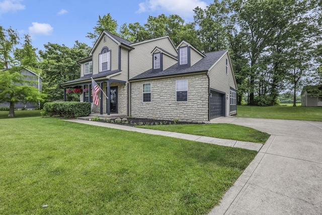 173 Zackary Dr, Granville, OH 43023 - view of front of home featuring stone siding, driveway, a front yard, an attached garage, and a shingled roof