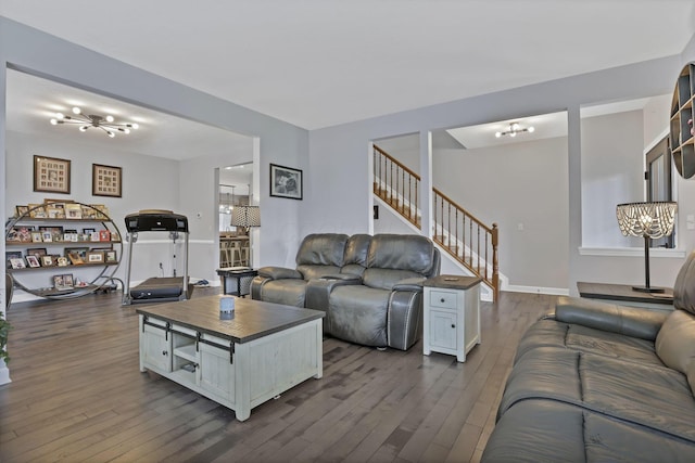 173 Zackary Dr, Granville, OH 43023 - living room featuring a chandelier, dark wood finished floors, and stairs