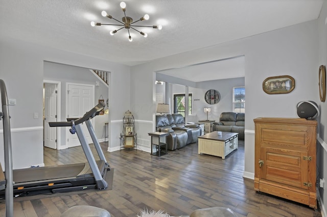 173 Zackary Dr, Granville, OH 43023 - exercise area featuring a chandelier, dark wood finished floors, and a textured ceiling