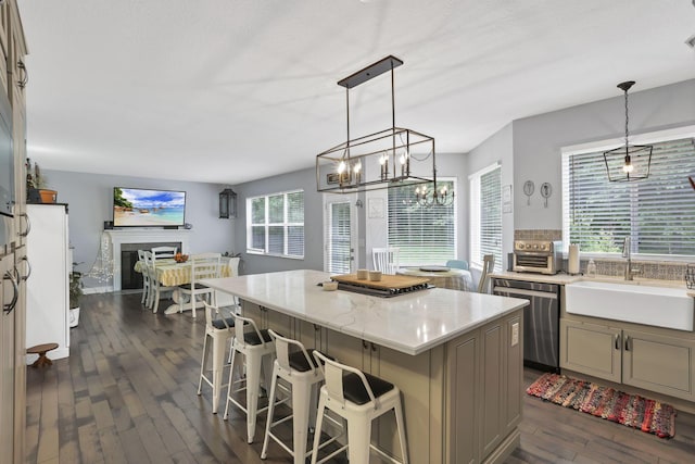 173 Zackary Dr, Granville, OH 43023 - kitchen featuring dishwasher, dark wood finished floors, a center island, a chandelier, and a kitchen breakfast bar