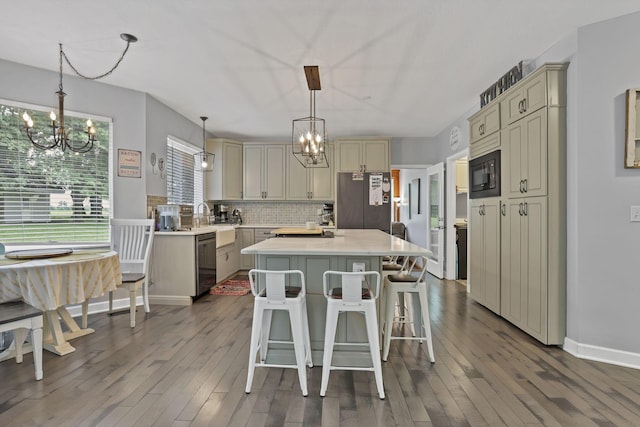 173 Zackary Dr, Granville, OH 43023 - kitchen featuring a chandelier, appliances with stainless steel finishes, cream cabinetry, and a center island