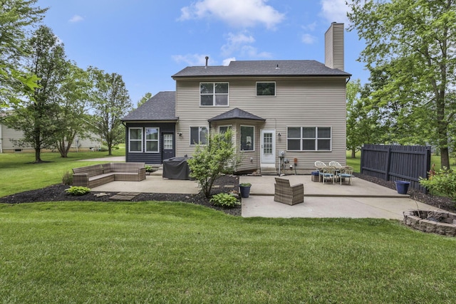 173 Zackary Dr, Granville, OH 43023 - rear view of property featuring a patio area, a chimney, an outdoor fire pit, and a shingled roof