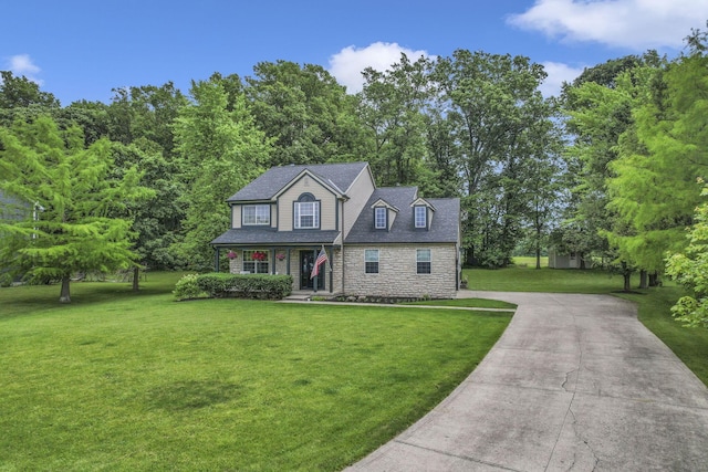 173 Zackary Dr, Granville, OH 43023 - view of front of property with stone siding, concrete driveway, and a front yard
