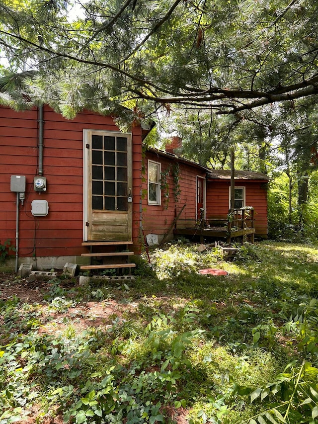 13428 King Rd NE, Thornville, OH 43076 - view of side of property featuring entry steps, a chimney, and a deck