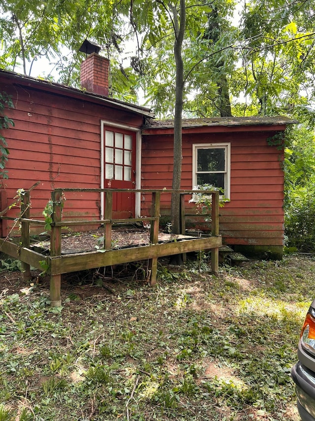 13428 King Rd NE, Thornville, OH 43076 - rear view of property with a chimney and a deck