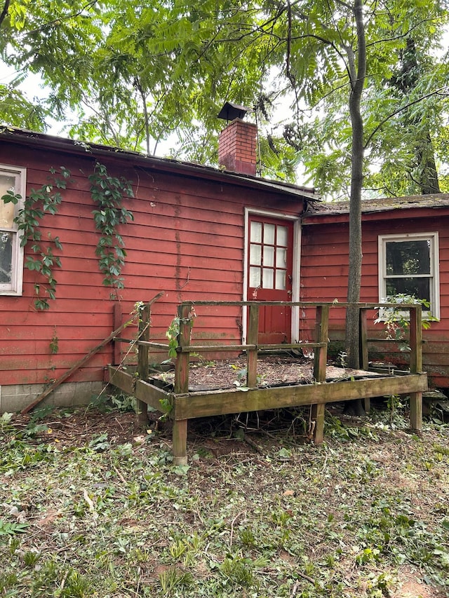 13428 King Rd NE, Thornville, OH 43076 - rear view of property with a chimney and a deck