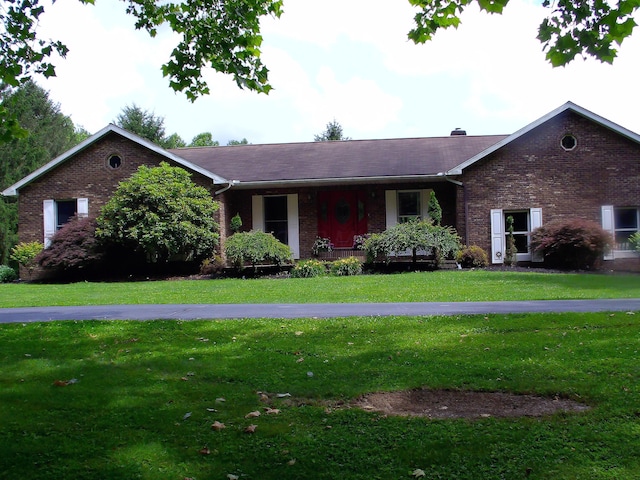 1110 Burr Oak Blvd, Nelsonville, OH 45764 - ranch-style house featuring brick siding, a front lawn, a porch, and a shingled roof