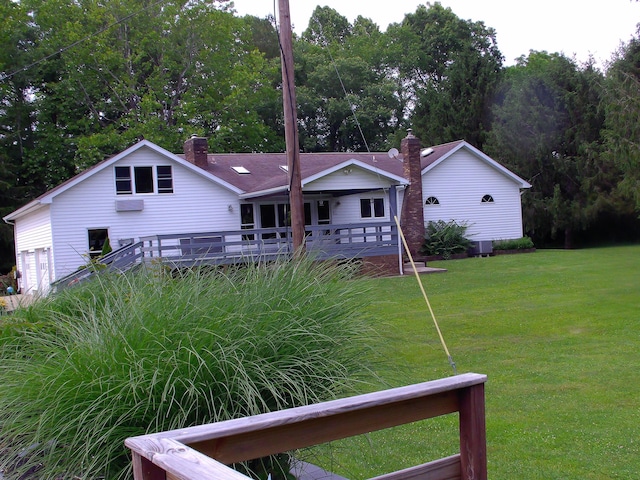 1110 Burr Oak Blvd, Nelsonville, OH 45764 - rear view of property featuring a yard, a deck, and a chimney