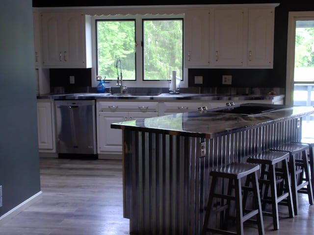 1110 Burr Oak Blvd, Nelsonville, OH 45764 - kitchen featuring dishwasher, white cabinets, and light wood-type flooring