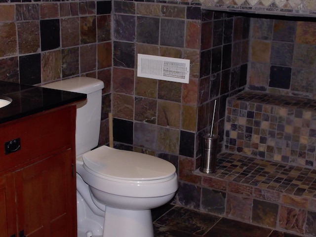 1110 Burr Oak Blvd, Nelsonville, OH 45764 - bathroom with vanity, decorative backsplash, and tile walls