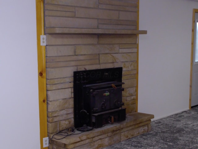 1110 Burr Oak Blvd, Nelsonville, OH 45764 - detailed view of carpet and a wood stove