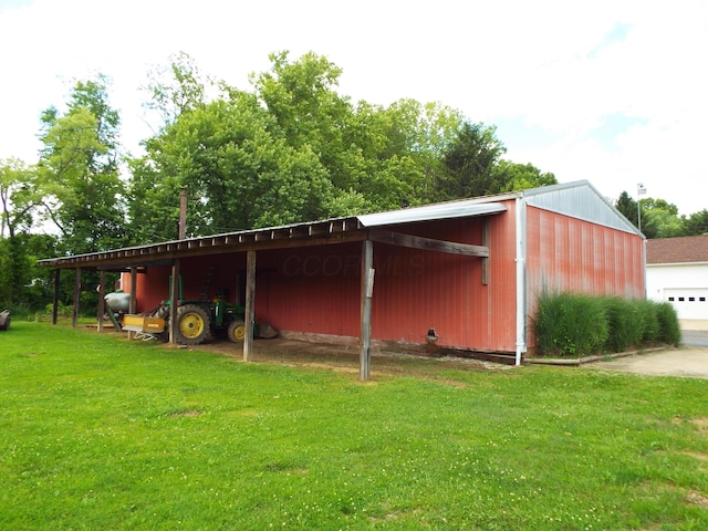 1110 Burr Oak Blvd, Nelsonville, OH 45764 - view of pole building with a lawn and a carport
