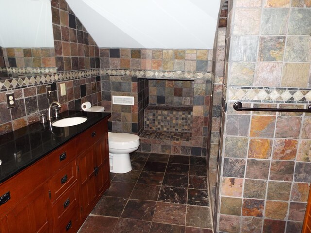 1110 Burr Oak Blvd, Nelsonville, OH 45764 - full bath featuring vanity, tiled shower, and tile walls