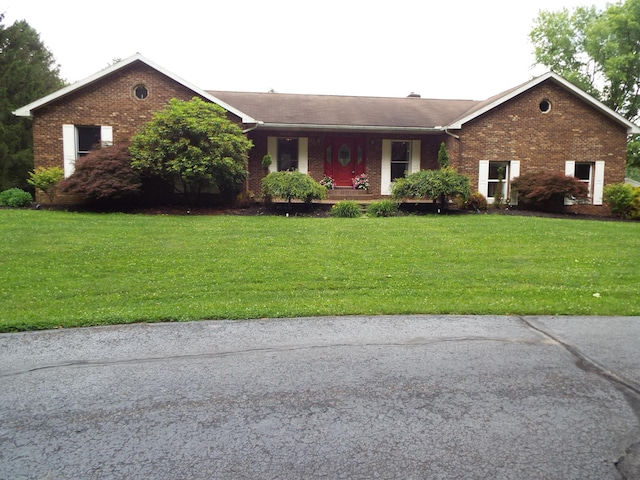 1110 Burr Oak Blvd, Nelsonville, OH 45764 - ranch-style house with brick siding, a front lawn, and a porch