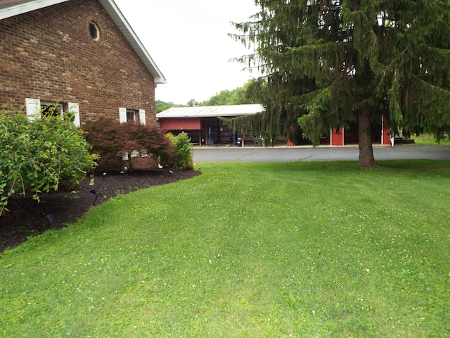 1110 Burr Oak Blvd, Nelsonville, OH 45764 - view of grassy yard with asphalt driveway