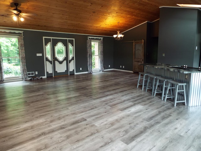 1110 Burr Oak Blvd, Nelsonville, OH 45764 - unfurnished living room featuring vaulted ceiling, wood ceiling, a chandelier, wood finished floors, and a ceiling fan