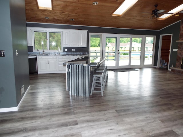 1110 Burr Oak Blvd, Nelsonville, OH 45764 - kitchen featuring vaulted ceiling, wooden ceiling, dishwashing machine, white cabinets, and ceiling fan