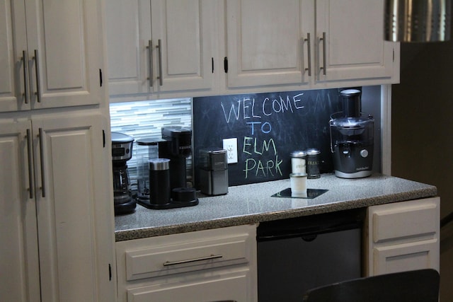 1261 Elm Park Pl, Galloway, OH 43119 - kitchen featuring white cabinetry and decorative backsplash