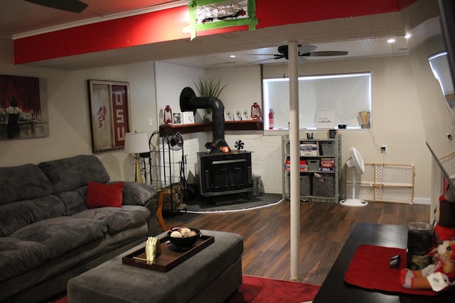 1261 Elm Park Pl, Galloway, OH 43119 - living area featuring a wood stove, wood finished floors, and a ceiling fan