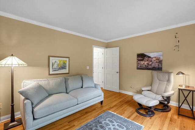 7661 Norhill Rd, Columbus, OH 43235 - living room featuring ornamental molding and wood finished floors