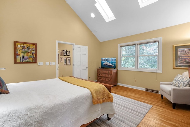 7661 Norhill Rd, Columbus, OH 43235 - bedroom with a skylight, light wood-style flooring, and high vaulted ceiling