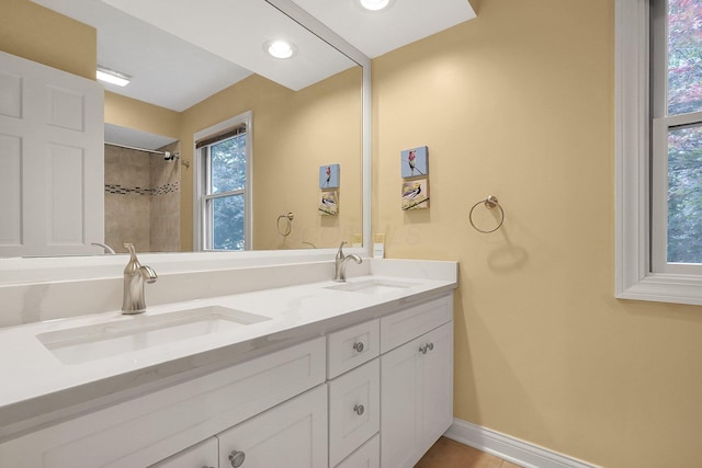 7661 Norhill Rd, Columbus, OH 43235 - bathroom with double vanity, recessed lighting, and a shower
